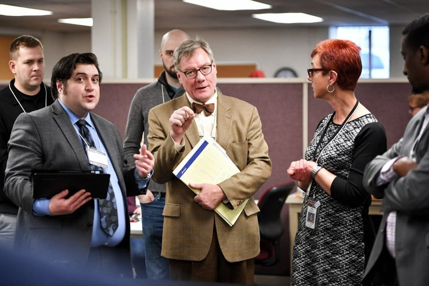 Attorneys for Noor, Matt Streff and for Warsame, Brian Rice looked over recount results from precincts 2,3 and 7 which remained mostly unchanged. Noor's attorney Matt Streff then called an end to the recount they asked for. Grace Wachlarowicz, Minneapolis Director of Elections is on the right.