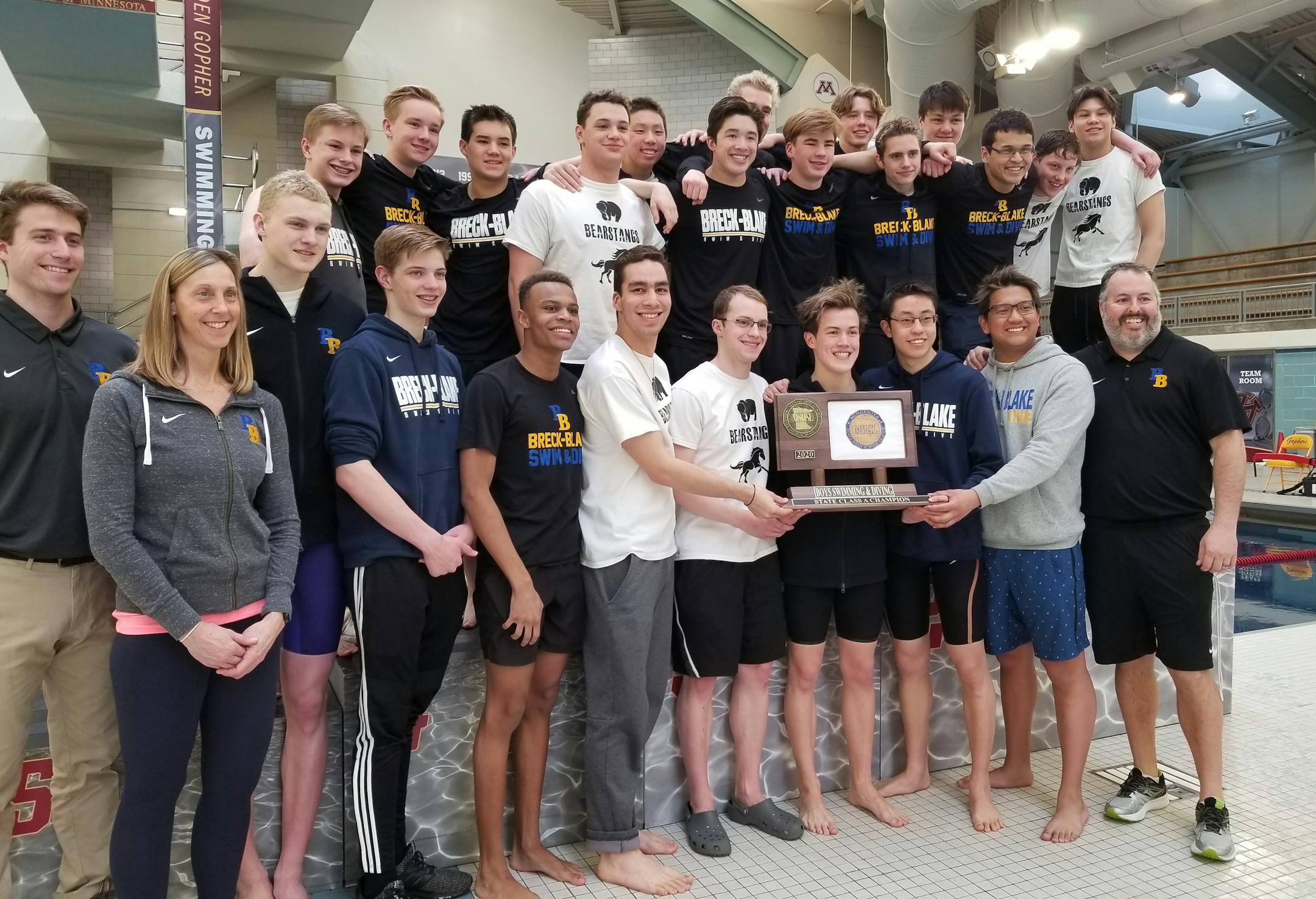 Breck/Blake teammates posed with the Class 1A trophy Saturday after winning their fourth consecutive state championship. Photo: Heather Rule, special to the Star Tribune