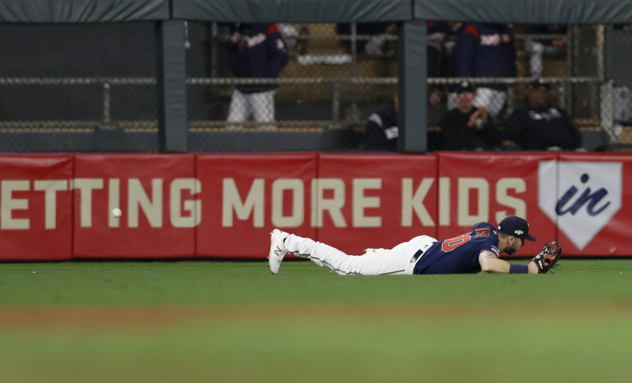 Minnesota Twins right fielder Jake Cave (60) missed a grounder hit by New York Yankees center fielder Brett Gardner (11) in the third inning.