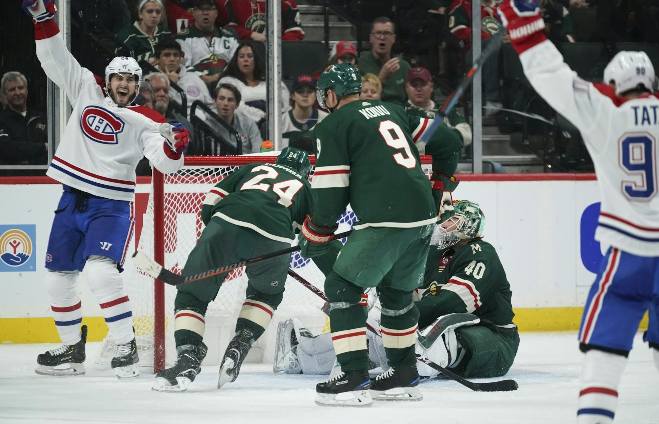 Montreal Canadiens left wing Phillip Danault (24) celebrated after scoring a go ahead goal in the third period on Minnesota Wild goaltender Devan Dubnyk (40) with Matt Dumba (24) defending.