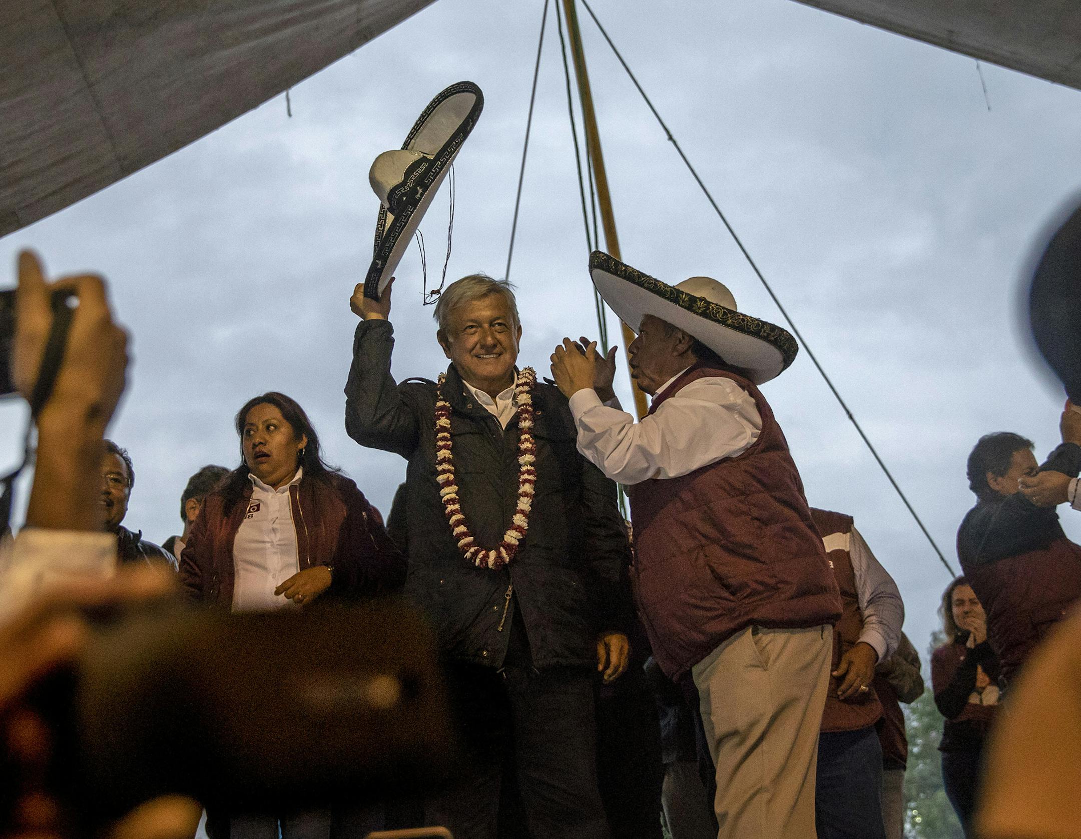FILE -- Andrés Manuel López Obrador, a presidential candidate commonly known as AMLO, greets the crowd during a campaign rally in Chimalhuacán, on the outskirts of Mexico City, June 14, 2018. Faced with the reality of a limited budget and soaring crime, López Obrador, the president-elect, is scaling back campaign commitments — even before taking office. (Alejandro Cegarra/The New York Times)
