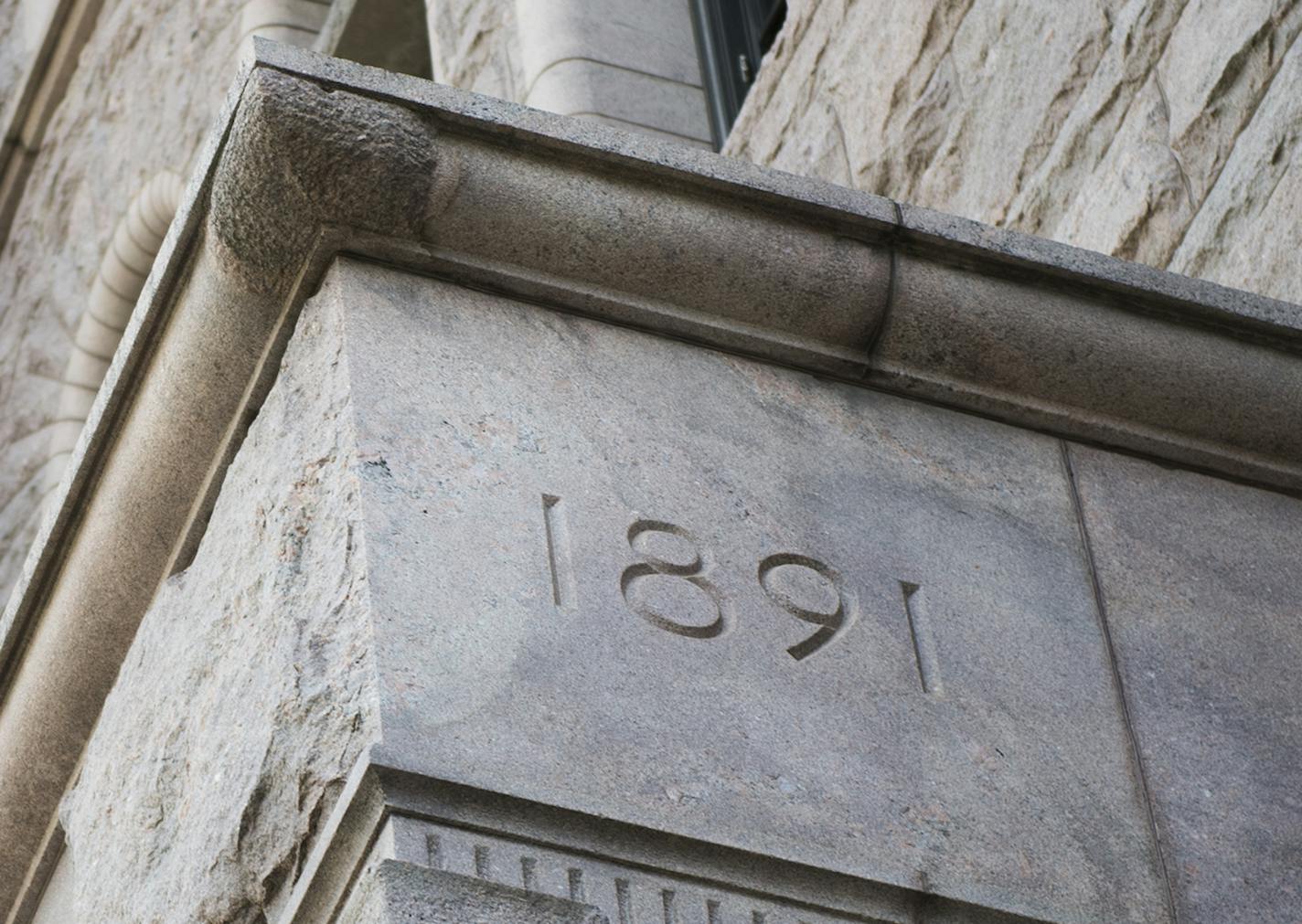 The cornerstone of the Minneapolis City Council building, which was placed in 1891, lies a story up in the building's front side along S 4th St. ] Isaac Hale &#xef; isaac.hale@startribune.com Teresa Baker, of the Municipal Building Commission, gave a tour of the oddities and interesting facets of the Minneapolis City Council building on Monday, June 27, 2016.