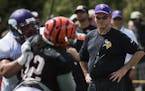 Minnesota Vikings head coach Mike Zimmer, right, watches from the sidelines during a joint NFL football practice with the Cincinnati Bengals, Wednesda