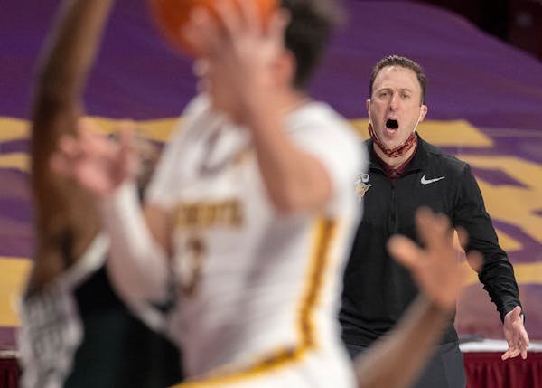 Gophers head coach Richard Pitino yelled direction for his team as David Mutaf (3) drove the lane during a game last month.