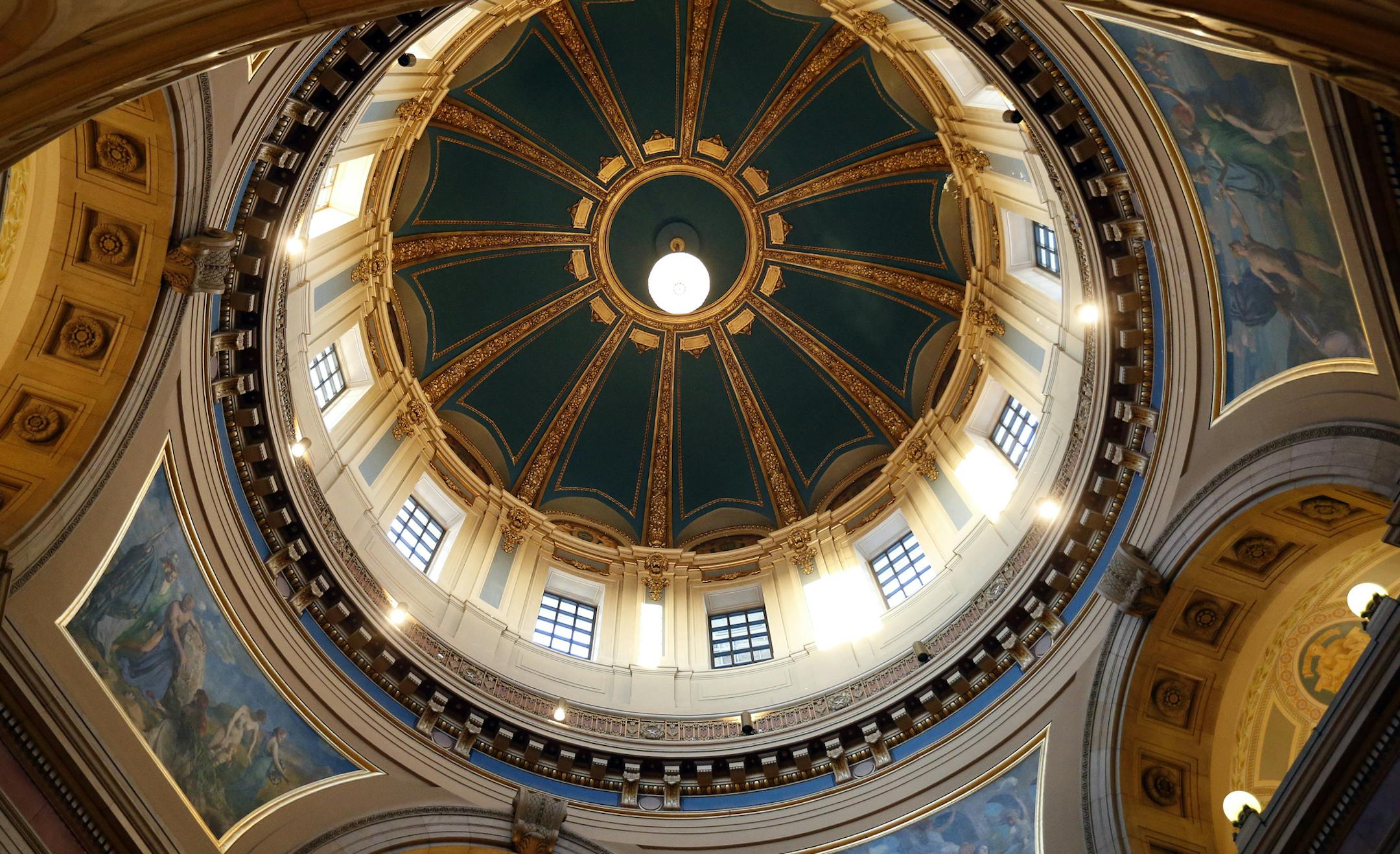 The chandelier was turned on after being raised in the rotunda at the Minnesota State Capitol on Thursday. The Chandelier lighting and raising ceremony took place after the Chandelier's two-year absence. ] CARLOS GONZALEZ cgonzalez@startribune.com - January 17, 2013, St. Paul, Minn., The Chandelier lighting and raising ceremony at the State Capitol starts at 4pm this Thursday 1/17. The Minnesota State Capitol's massive chandelier will soon be hanging high in the rotunda again after a two-year ab