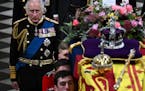 Britain's King Charles III walks behind the coffin of Queen Elizabeth II in Westminster Abbey in central London, Monday Sept. 19, 2022. The Queen, who
