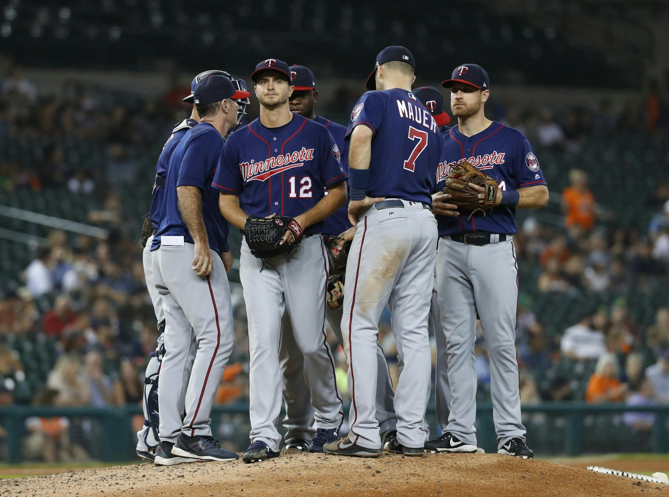 Minnesota Twins manager Paul Molitor takes the ball from pitcher Jake Odorizzi (12) during the seventh inning of a baseball game against the Detroit Tigers in Detroit, Tuesday, Sept. 18, 2018.