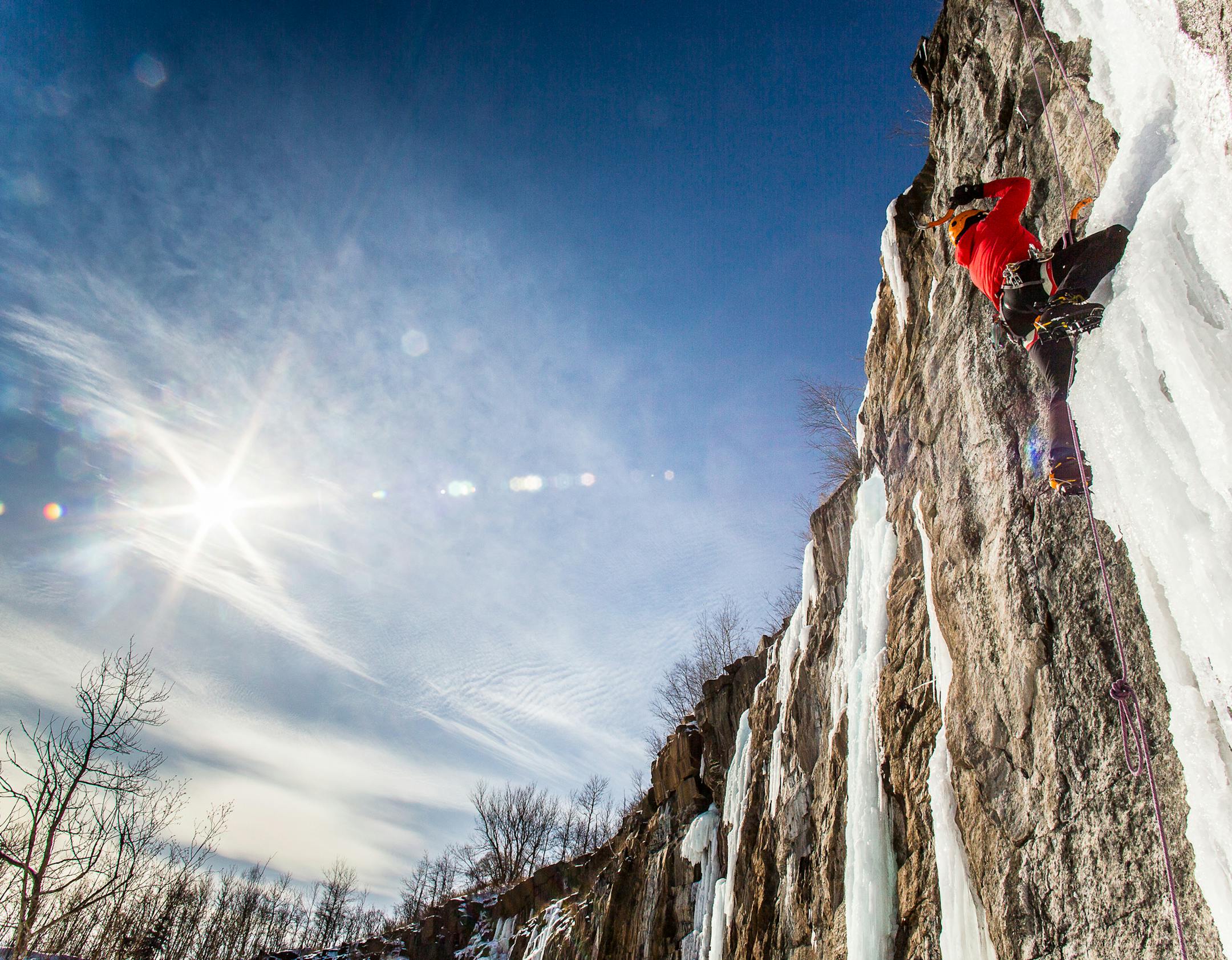 An ice climber scales the cliff at what is known as Quarry Park in Duluth