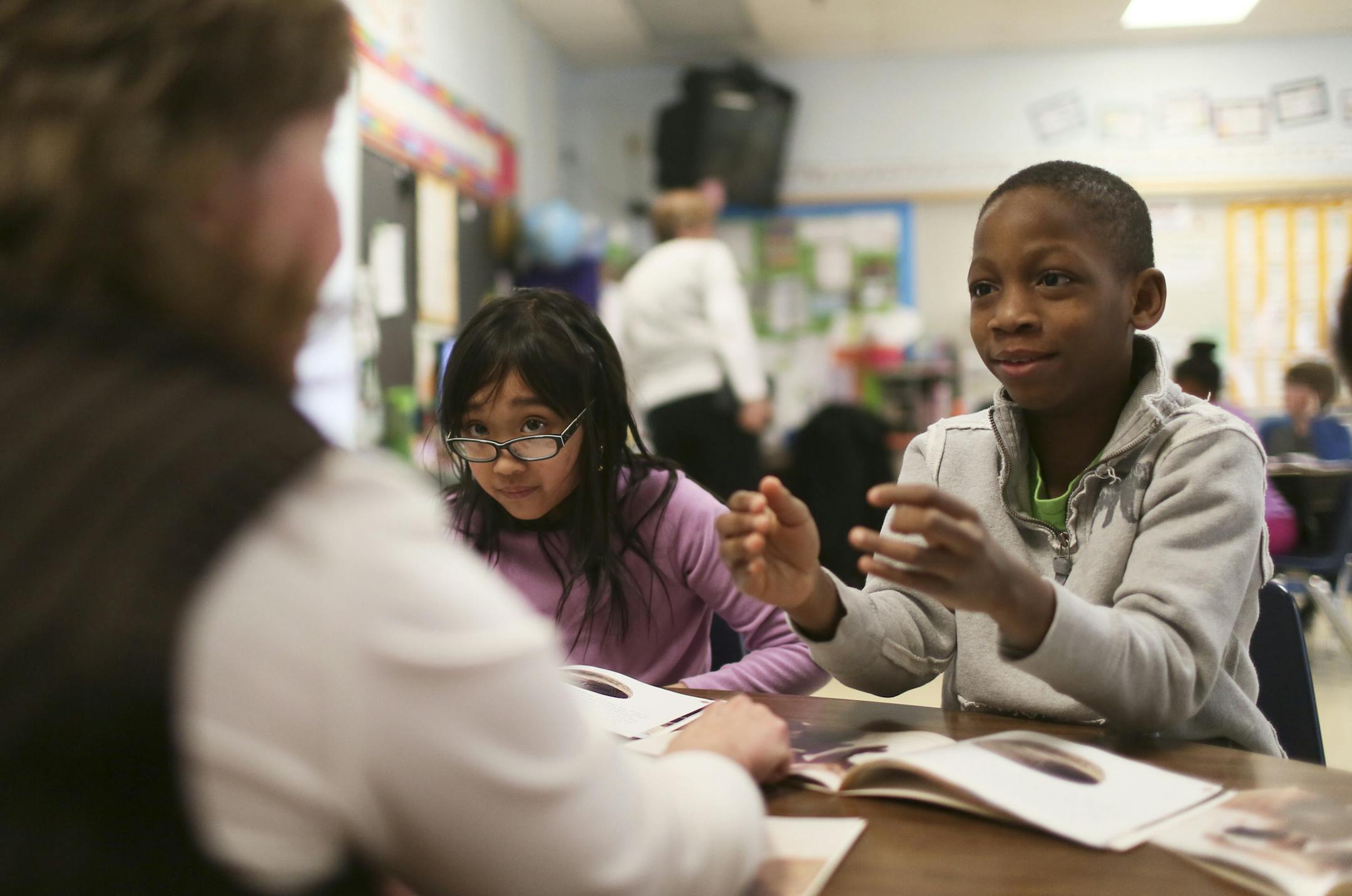 Monroe Elementary School third-graders Jenny Khon and Ezekiel Olagunju read about Native Americans and their cliff dwellings on Tuesday from a book called &#x201c;Pueblo Ruins.&#x201d; Working with them was teacher Ann Mylrea.