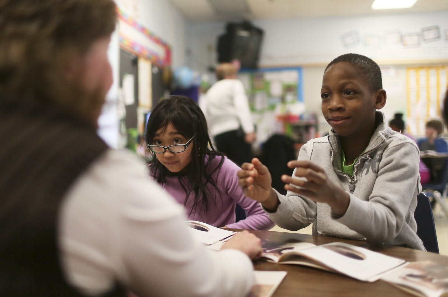 Monroe Elementary School third-graders Jenny Khon and Ezekiel Olagunju read about Native Americans and their cliff dwellings on Tuesday from a book called &#x201c;Pueblo Ruins.&#x201d; Working with them was teacher Ann Mylrea.