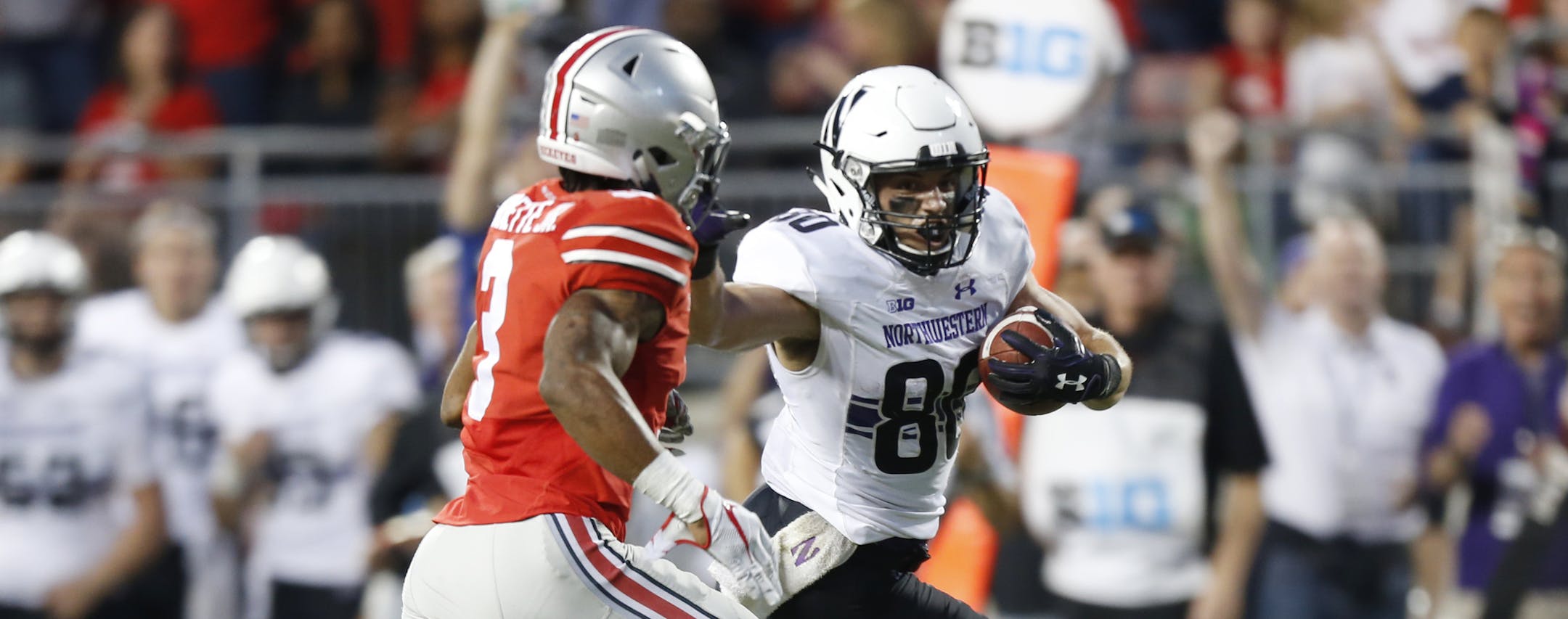Northwestern receiver Austin Carr, right, races upfield against Ohio State cornerback Damon Arnette during the second half of an NCAA college football game Saturday, Oct. 29, 2016, in Columbus, Ohio. Ohio State beat Northwestern 24-20. (AP Photo/Jay LaPrete)