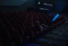 A sole spectator watches a film in a movie theatre in Budapest, Hungary, Thursday, March 12, 2020. Effective from today, cinemas in Hungary are restri