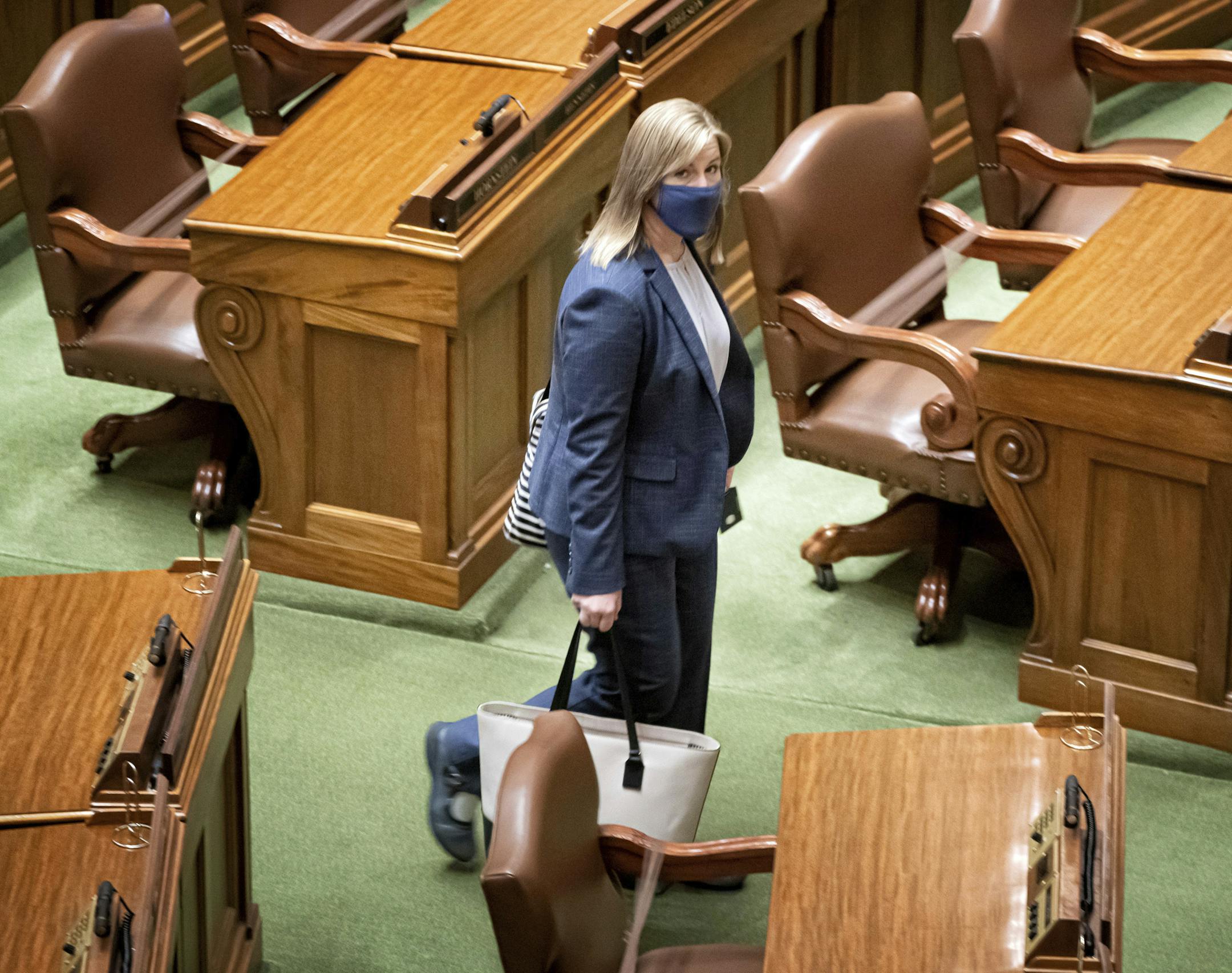 House Speaker Melissa Hortman, DFL-Brooklyn Park comes into the House Chamber at the start of another special session Monday, July 20, 2020 in St. Paul, Minn. With him is Assistant Minority Leader Rep. Anne Neu, R-North Branch.(Glenn Stubbe/Star Tribune via AP)