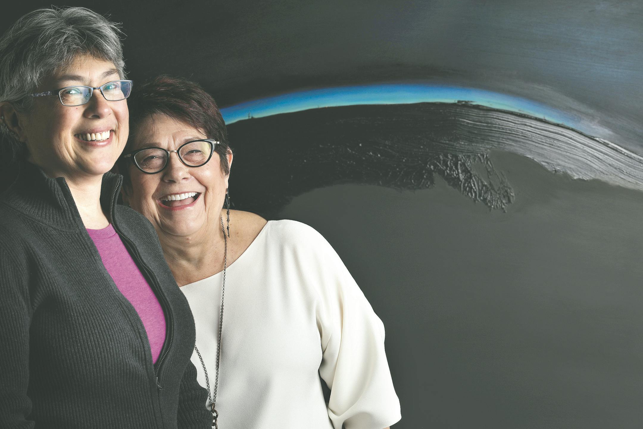"A search for beauty" underlies both science and art, says astrophysicist Liliya Williams, left, with artist Mary Simon-Casati. They posed at an exhibit of Simon-Casati's work at the University of Minnesota.