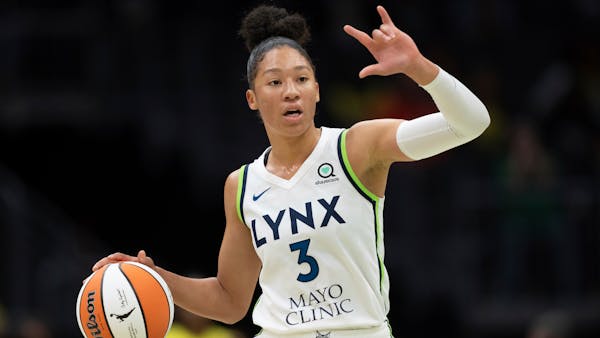 Minnesota Lynx forward-guard Aerial Powers dribbles the ball during a WNBA basketball game against the Seattle Storm, Friday, May 6, 2022, in Seattle.