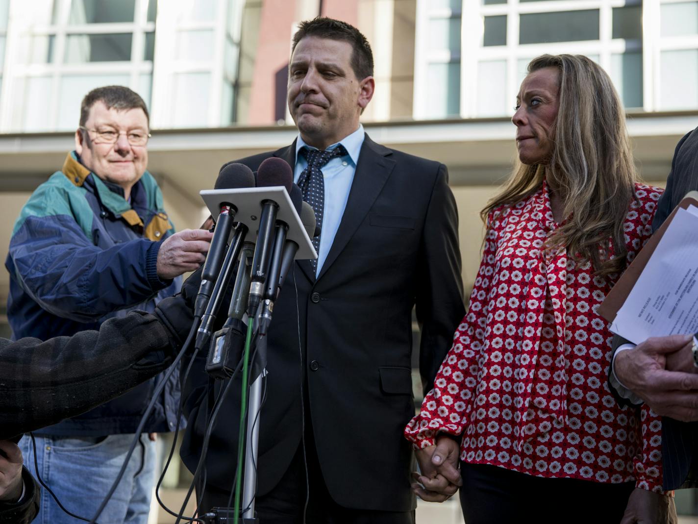 Jared Scheierl, holding the hand of his girlfriend Stacy Liestman, spoke outside the U.S. Courthouse on Monday morning shortly after addressing Danny Heinrich at the sentencing. on November 21, 2016, in Minneapolis, Minn. ] RENEE JONES SCHNEIDER &#x2022; renee.jones@startribune.com