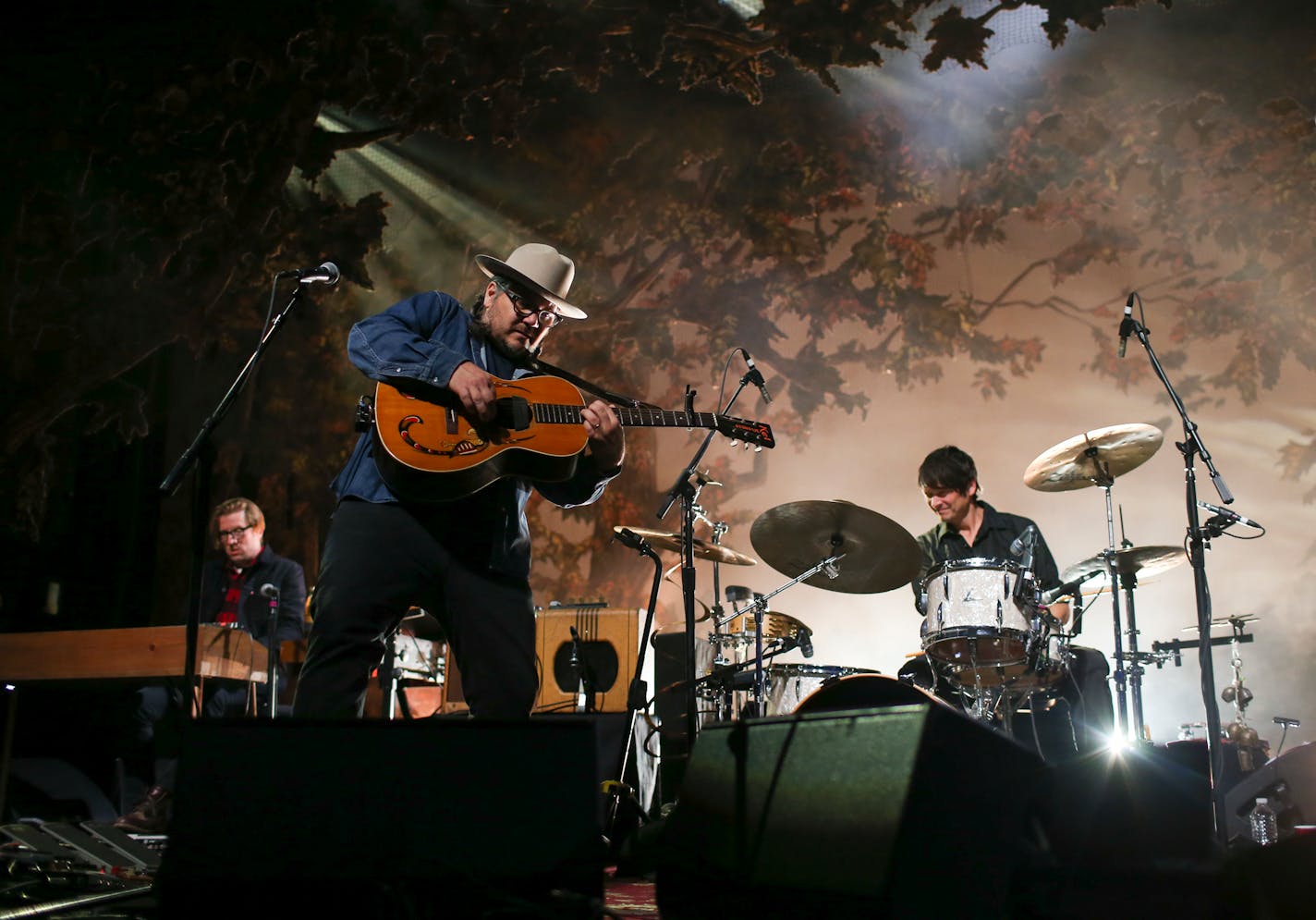 Jeff Tweedy, with Mikael Jorgensen on piano and drummer Glenn Kotche of Wilco early in their Palace Theatre show.