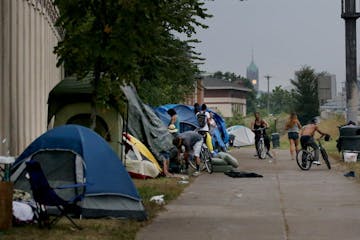 An American Indian encampment in south Minneapolis continues to grow and now includes several families with children. Some have come hoping to receive