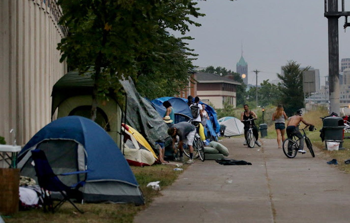 An American Indian encampment in south Minneapolis continues to grow and now includes several families with children. Some have come hoping to receive services that might end their homelessness. Here, the skies darken as a rain storm approaches Monday, Aug. 27, 2018, in Minneapolis, MN.] DAVID JOLES &#xef; david.joles@startribune.com Homeless families at the American Indian encampment in south Minneapolis**Koda Deer,cq