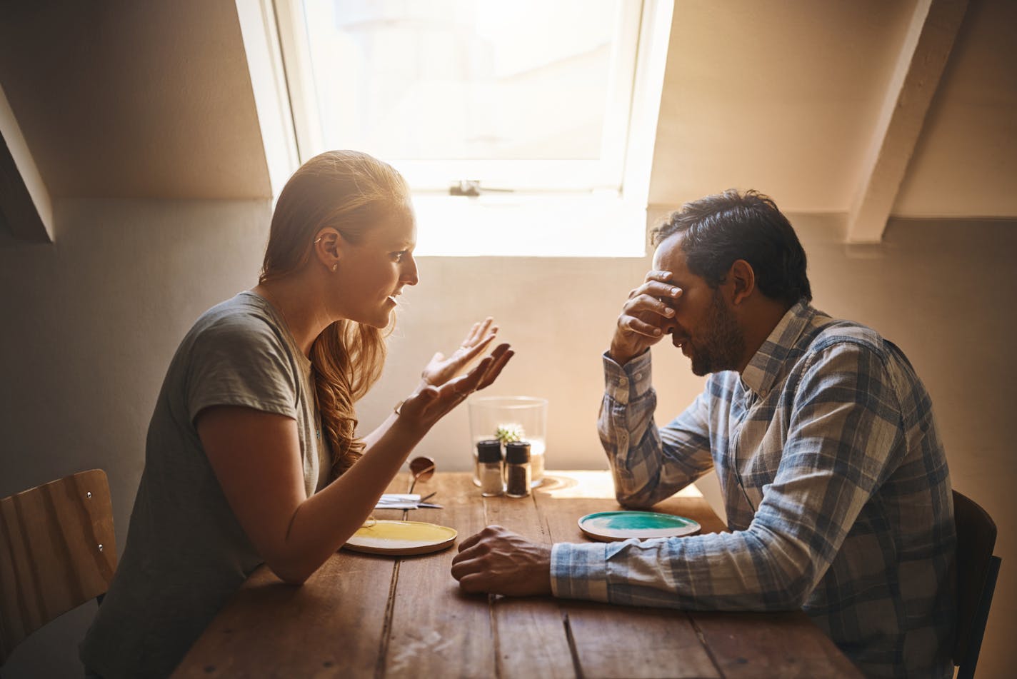 Shot of a young couple having a disagreement at a cafe