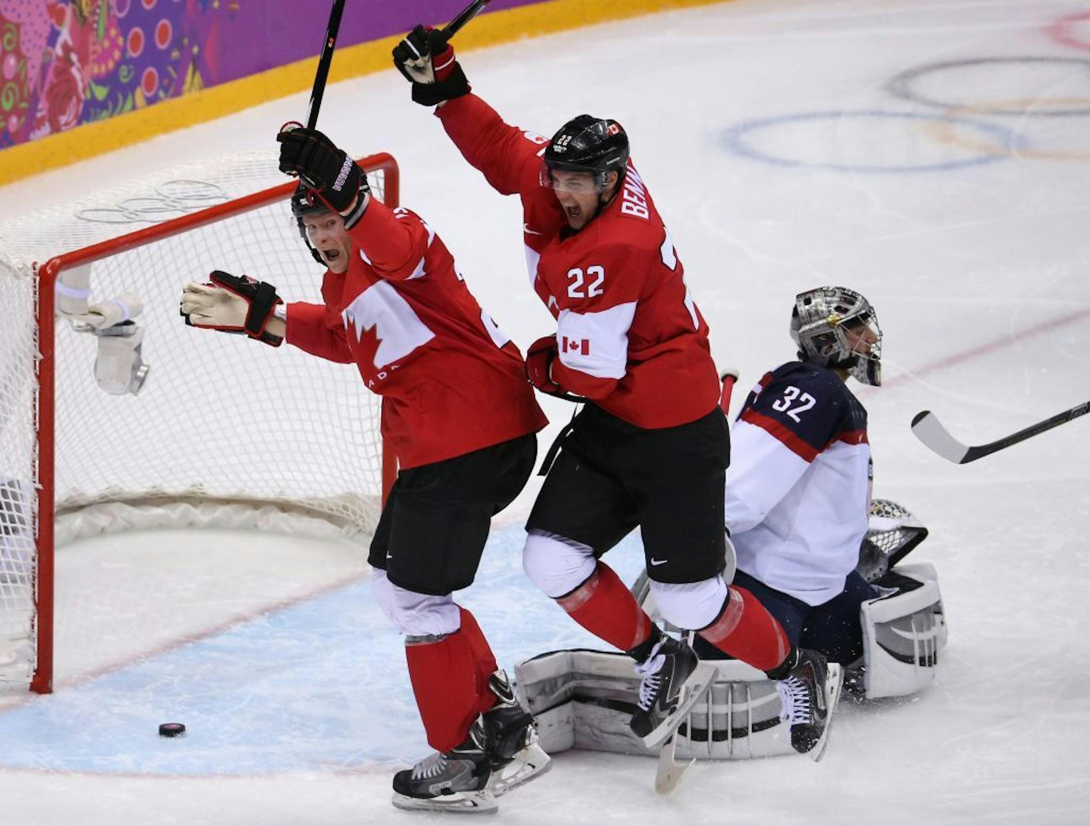 Canada forwards Corey Perry (24) and Jamie Benn (22) celebrate Benn's goal against USA goalie Jonathan Quick (32) in the second period of a men's hockey semifinal at Bolshoy Ice Dome during the Winter Olympics in Sochi, Russia, Friday, Feb. 21, 2014.