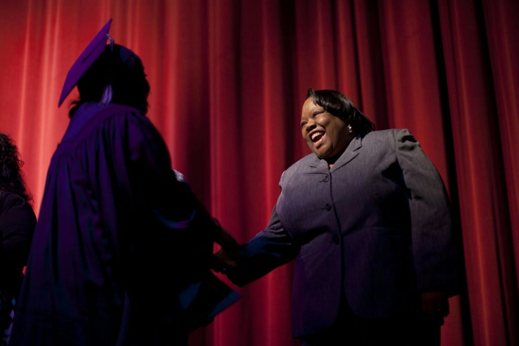 Jackie Starr warmly greeted one of the graduates of her POP program after she received her certificate at the ceremony last week at Brooklyn Center High School.