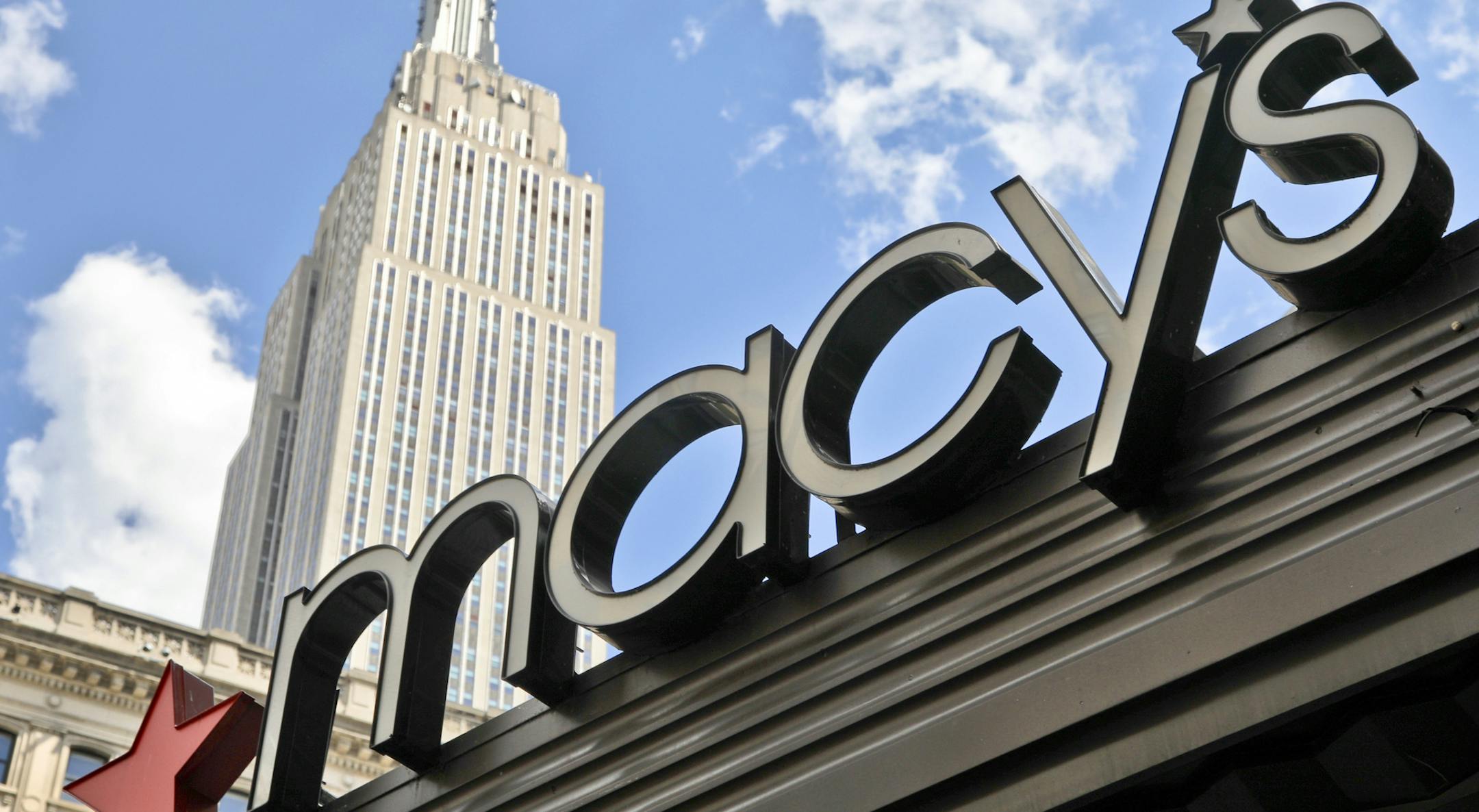 This Tuesday, May 2, 2017, photo shows Macy's corporate signage at its flagship store in New York. Macy's Inc. reports earnings, Thursday, Aug. 10, 2017. (AP Photo/Bebeto Matthews)