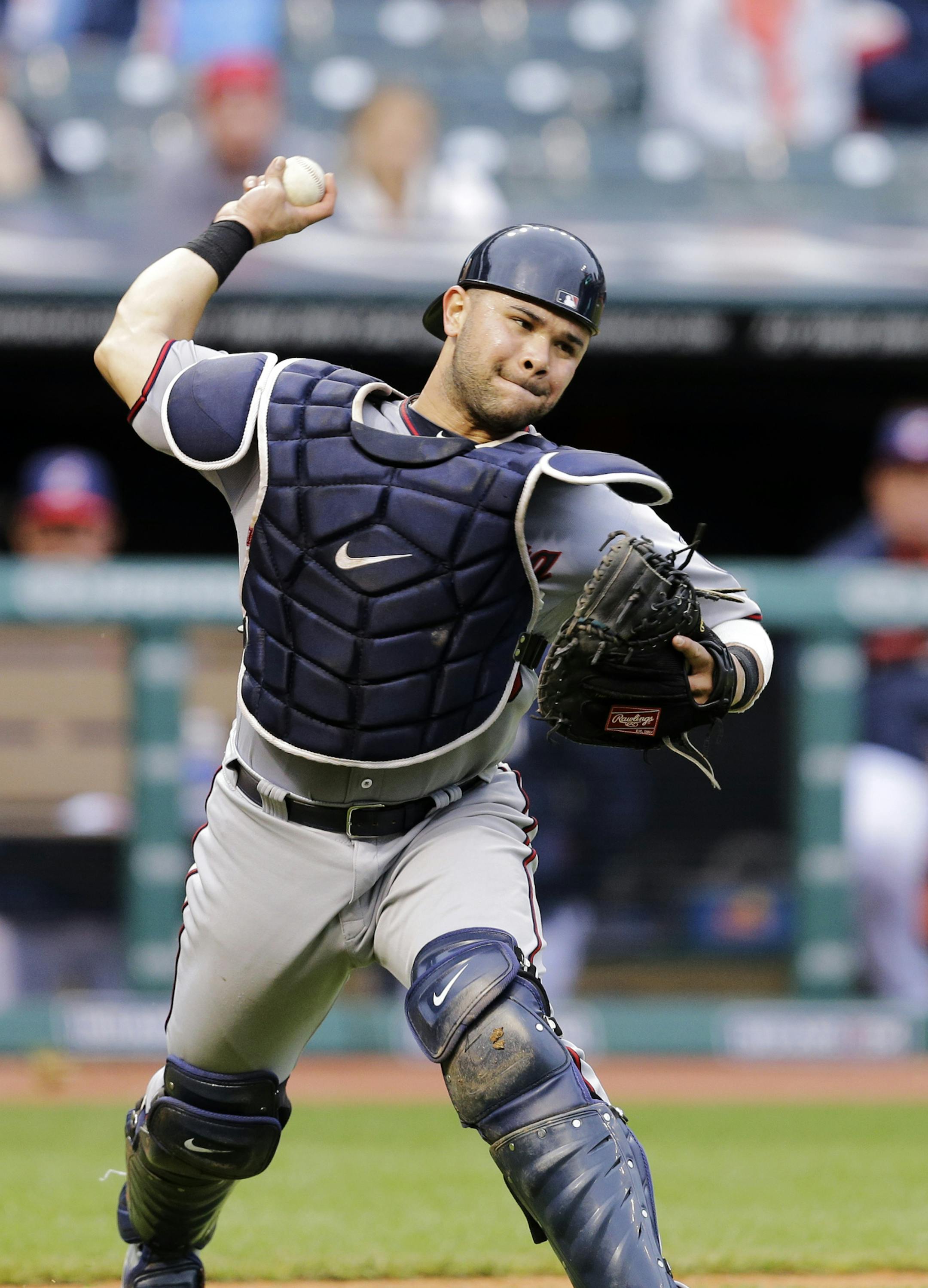 Minnesota Twins catcher Josmil Pinto throws out Cleveland Indians' Roberto Perez at first after a dropped third strike in the seventh inning of the to second game of a baseball doubleheader Thursday, Sept. 11, 2014, in Cleveland. (AP Photo/Mark Duncan)