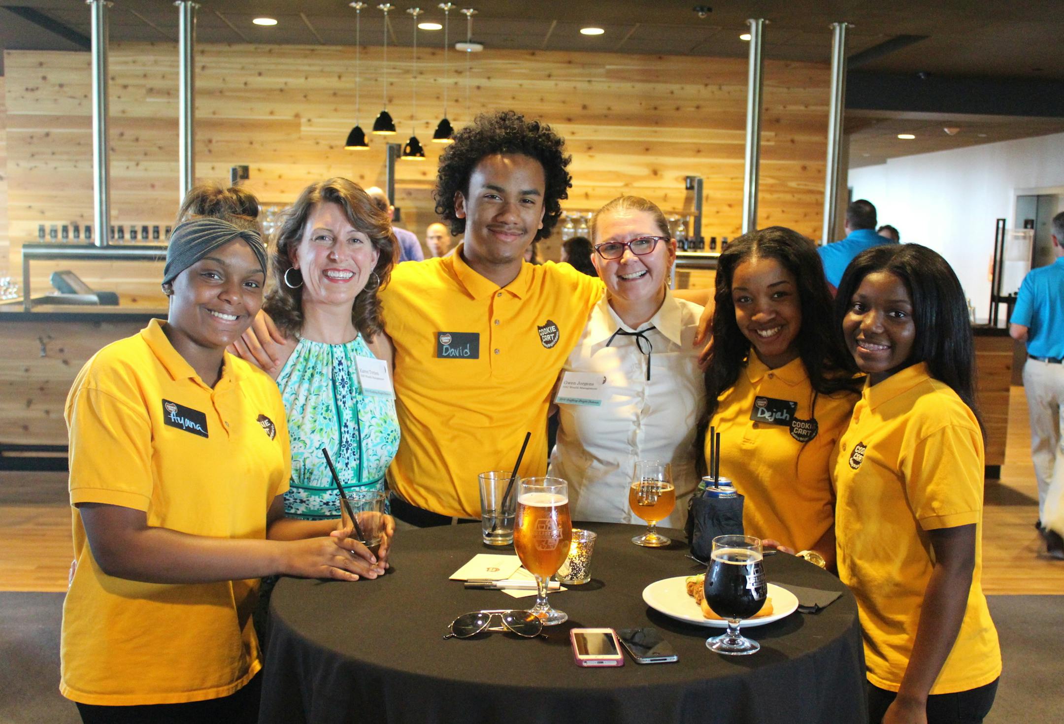 The Cookie Cart of North Minneaoplis, a nonprofit "social enterprise" started in the 1980s, trains up to 200 teenagers annually through training and part-time jobs of up to 30 hours weekly. The annual fundraiser Monday night at the Surley Brewery is expecte to raise more than $30,000. Pictured at last year's event were (left-to-right) Ayana, Karen Totten, David, Gwen Jorgens, Dejah and Myna.