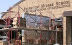 Construction at Rosemount Middle School, where workers are finishing up a new secure entryway. ] Minnesota schools are opening the new school year wit