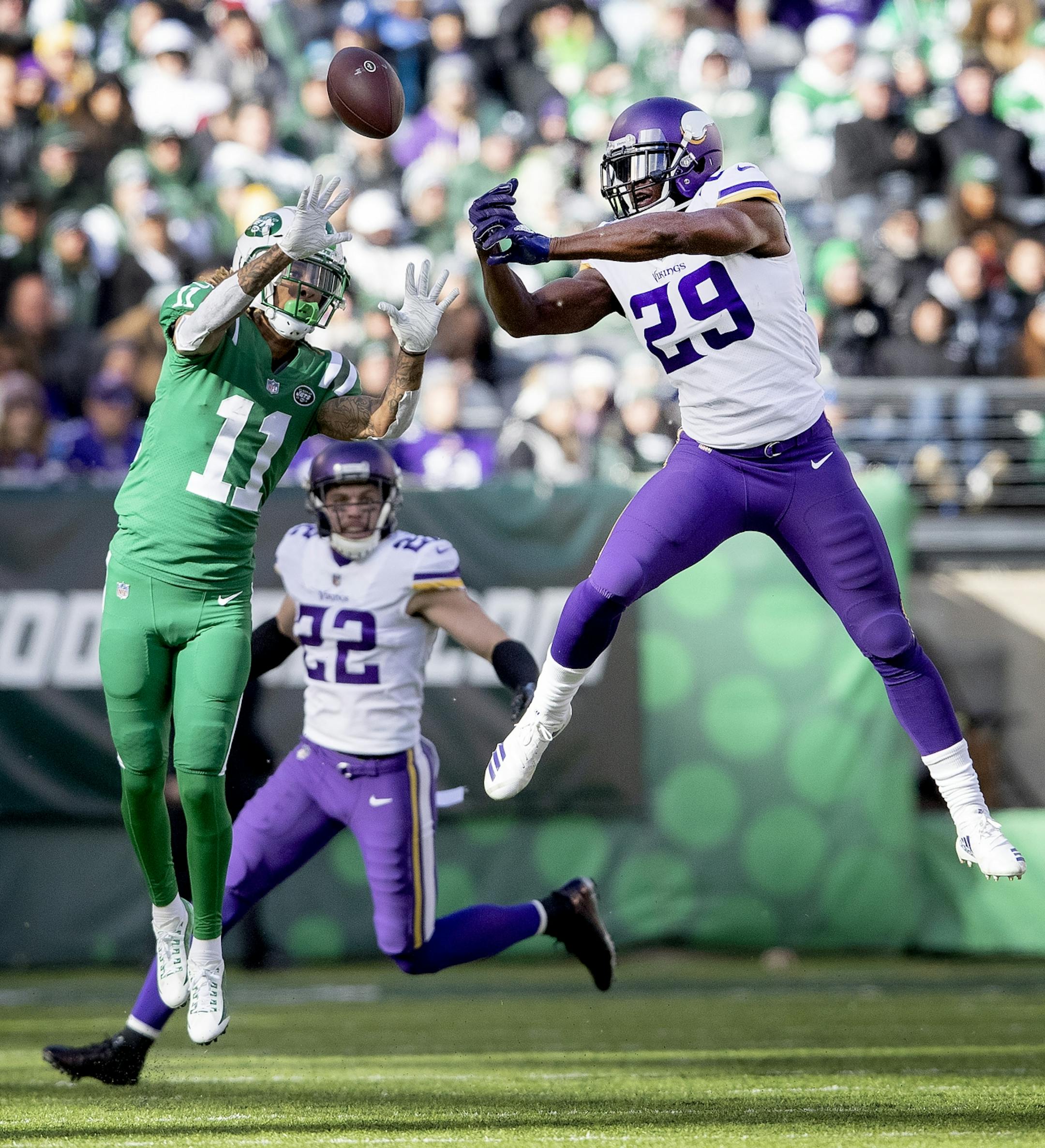 Xavier Rhodes (29) broke up a pass intended for Robby Anderson (11) in the third quarter. Harrison Smith (22) intercepted the ball on the play.