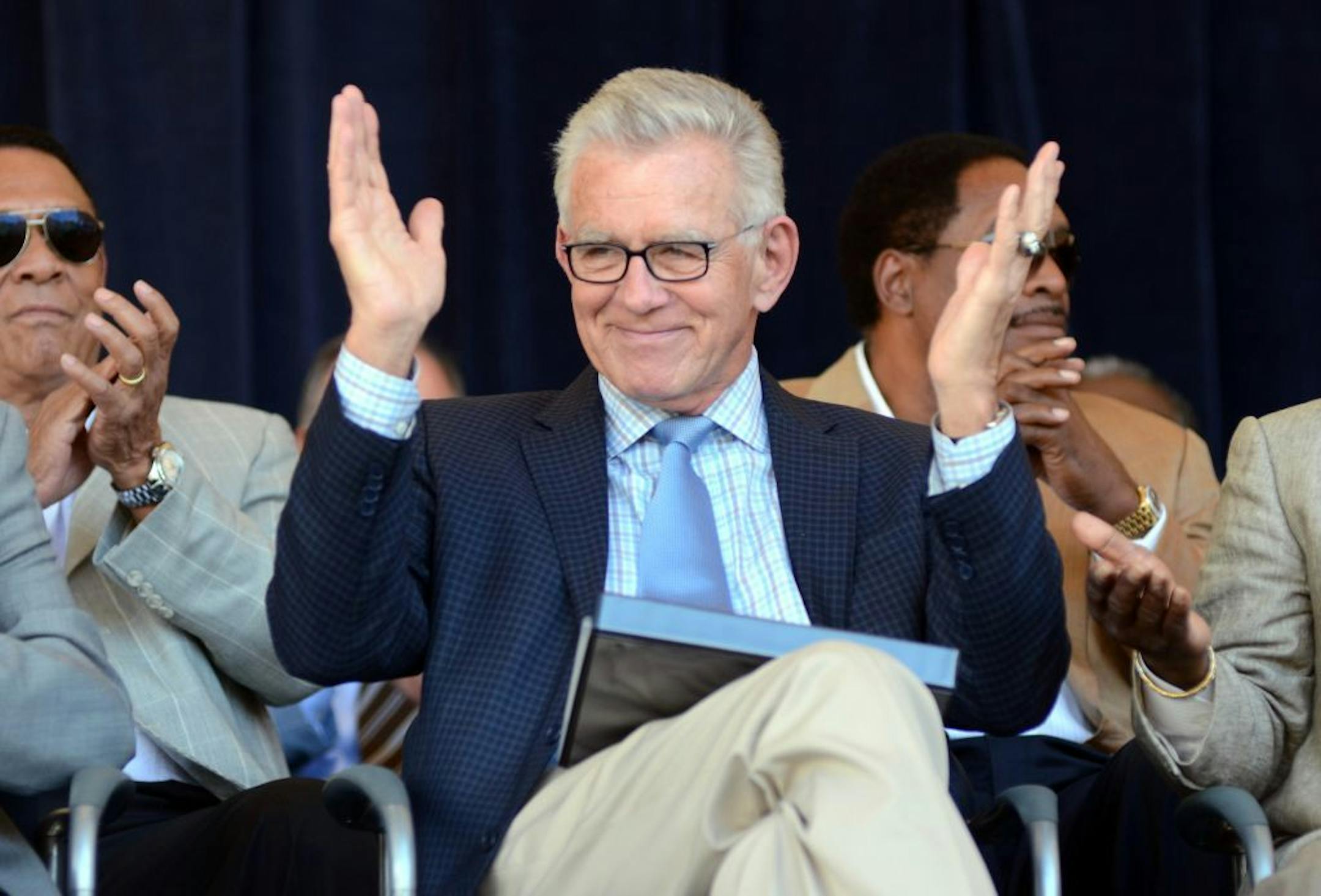 Tim McCarver greets the crowd before accepting the Ford C. Frick Award for excellence in baseball broadcasting as part of the Baseball Hall of Fame Induction ceremonies, at Doubleday Field in Cooperstown, N.Y., Saturday, July 21, 2012.