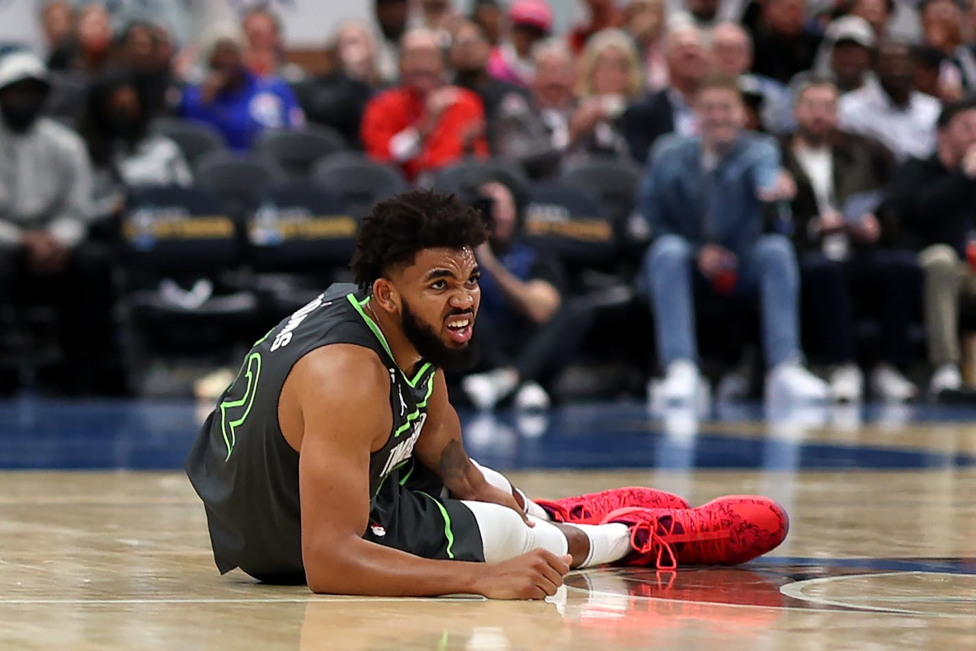 Karl-Anthony Towns (32) of the Minnesota Timberwolves reacts after being injured in the third quarter against the Washington Wizards at Capital One Arena on Nov. 28, 2022, in Washington, DC. (Rob Carr/Getty Images/TNS) ORG XMIT: 65160866W