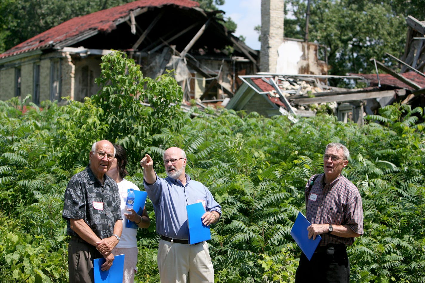 Chuck Liddy gave a tour and explained the future of Fort Snelling's Upper Post after a news conference Monday. The building behind Liddy recently collapsed.