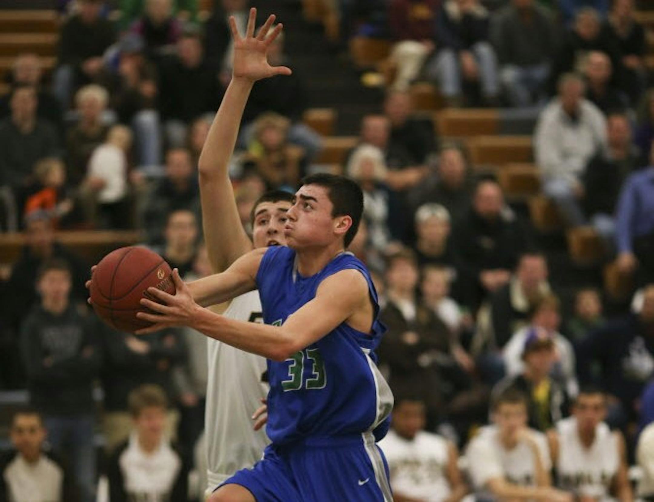 Eagan's Michael Gorder put up a first-half shot against Apple Valley's Brock Bertram in a recent game. After playing little on the varsity last year as a sophomore, Gorder has emerged as a scorer this year. He went for 39 points in a recent game against Lakeville South. Photo: Jeff Wheeler • jwheeler@startribune.com