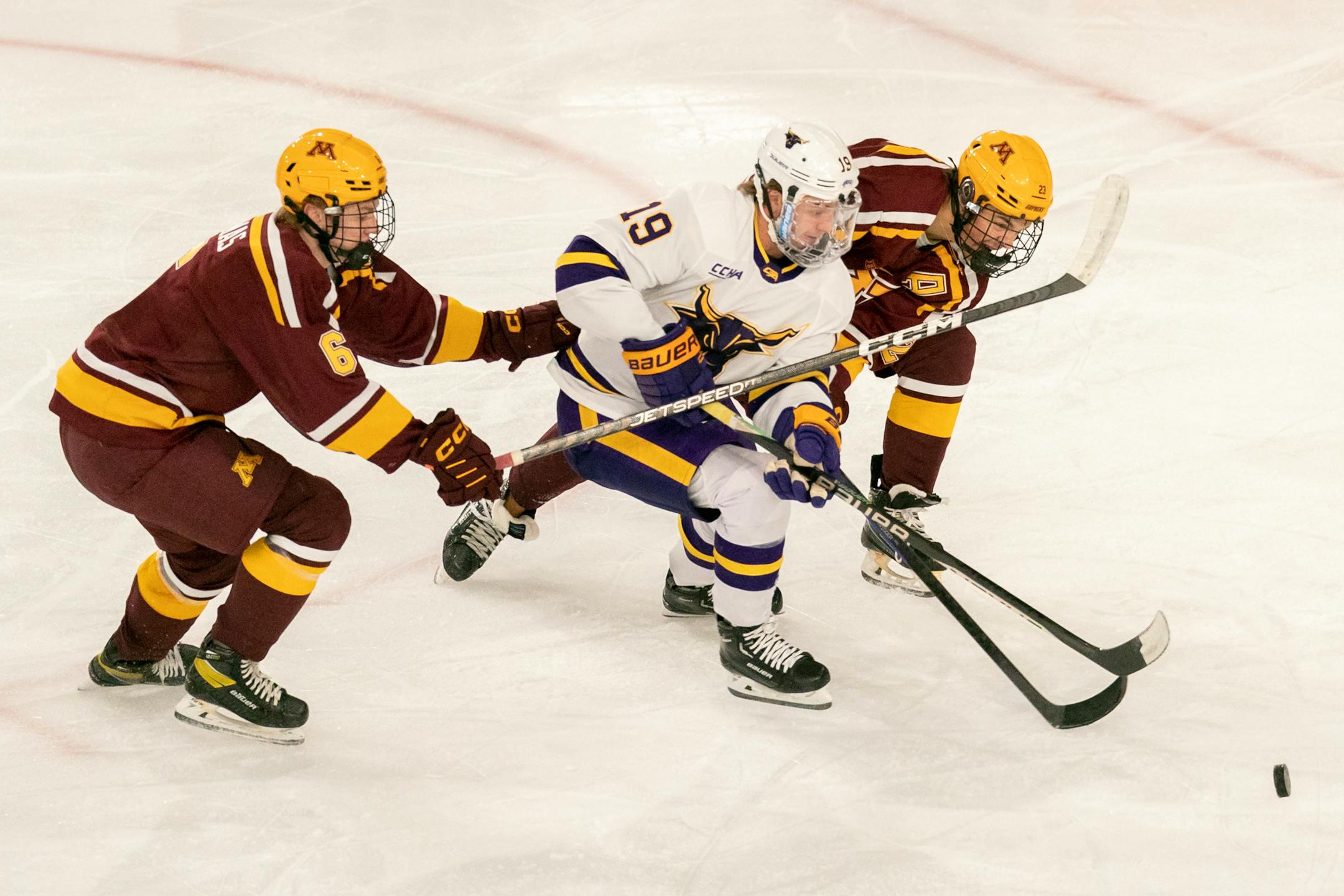 Minnesota State Mankato's Will Hillman (19) tried to squeeze between the Gophers' Cal Thomas (6) and Ryan Johnson (23) on Saturday, Oct.8, 2022, in Mankato, Minn. The Mavericks won 3-2. (Mansoor Ahmad, MSU Mankato athletics)