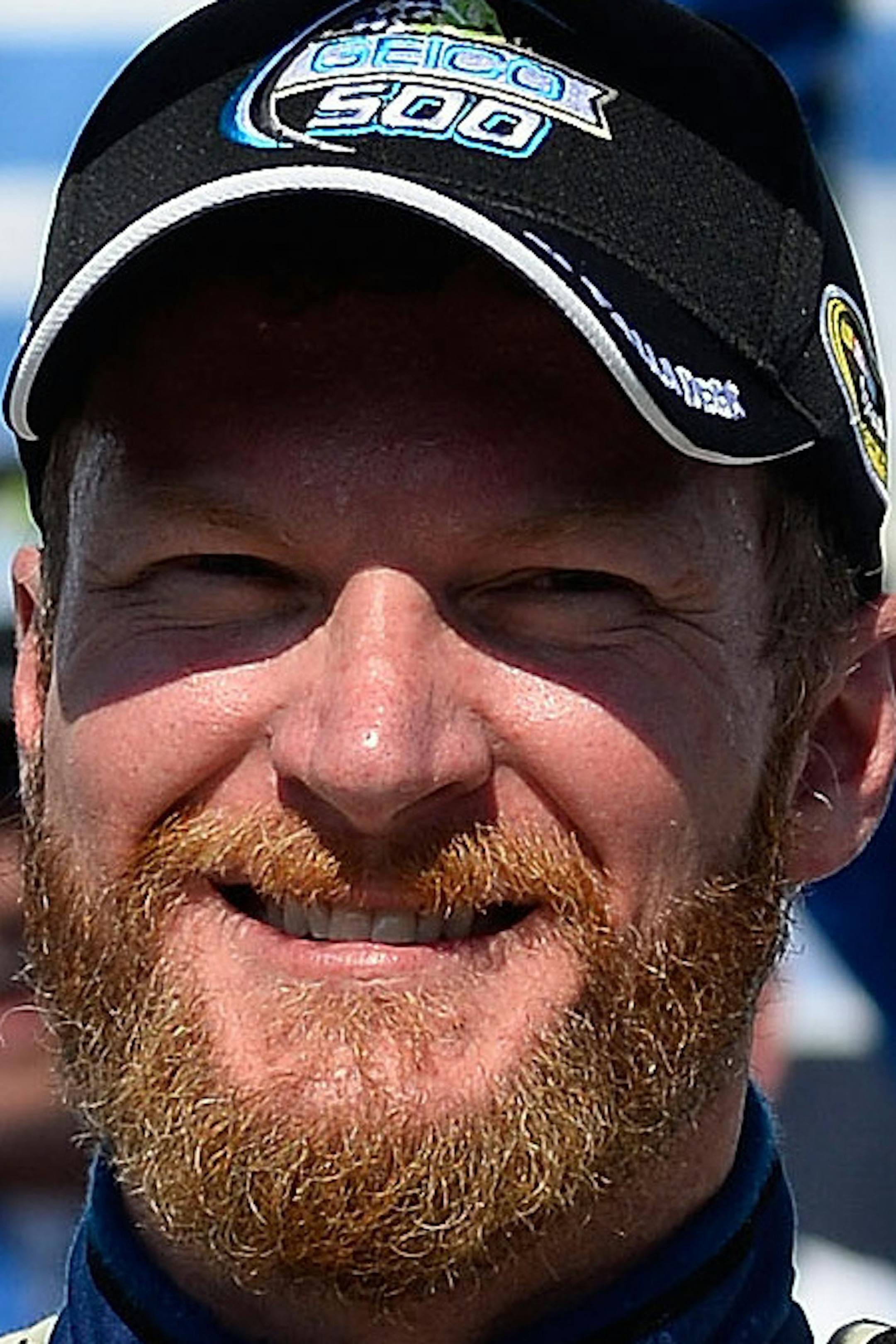 Dale Earnhardt Jr. hoists the trophy in Victory Lane after winning the Talladega 500 NASCAR Sprint Cup Series auto race at Talladega Superspeedway, Sunday, May 3, 2015, in Talladega, Ala. (AP Photo/David Tulis)