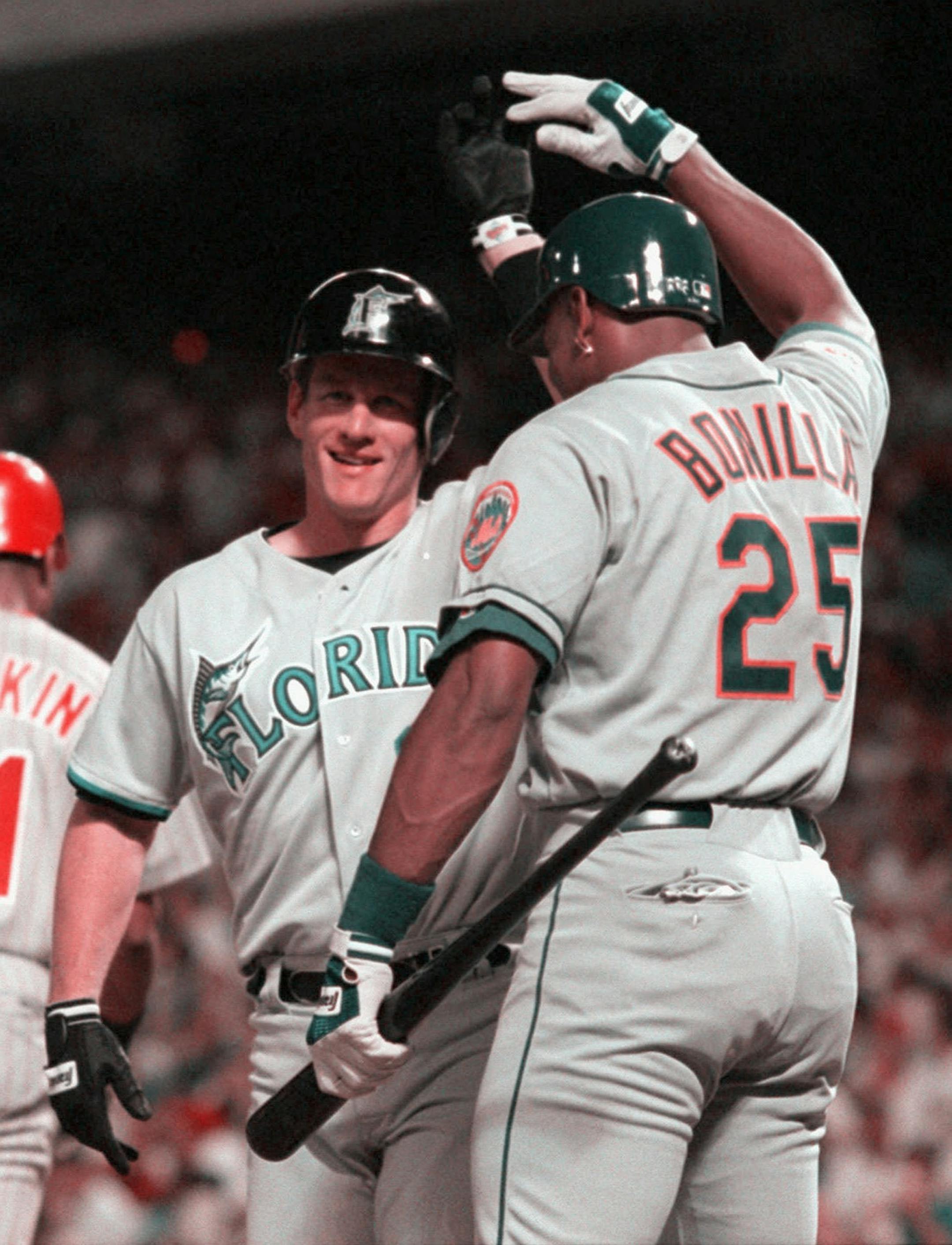 Florida Marlins' Jeff Conine is greeted by New York Mets' Bobby Bonilla after a game winning home-run in the eight inning of play at Tuesday night's All-Star Game at The Ballpark in Arlington, Texas, July 11, 1995. (AP Photo/Linda Kaye)