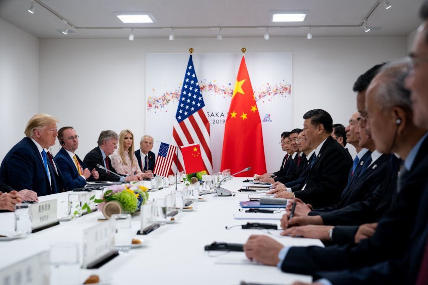 FILE -- President Donald Trump's bilateral meeting with President Xi Jinping of China at the G-20 Summit in Osaka, Japan, June 29, 2019. By allowing the Chinese currency to weaken past a key level this week, China's leader has adopted a hard-line stance, adding to the trade tensions that threaten the global economy and financial markets.