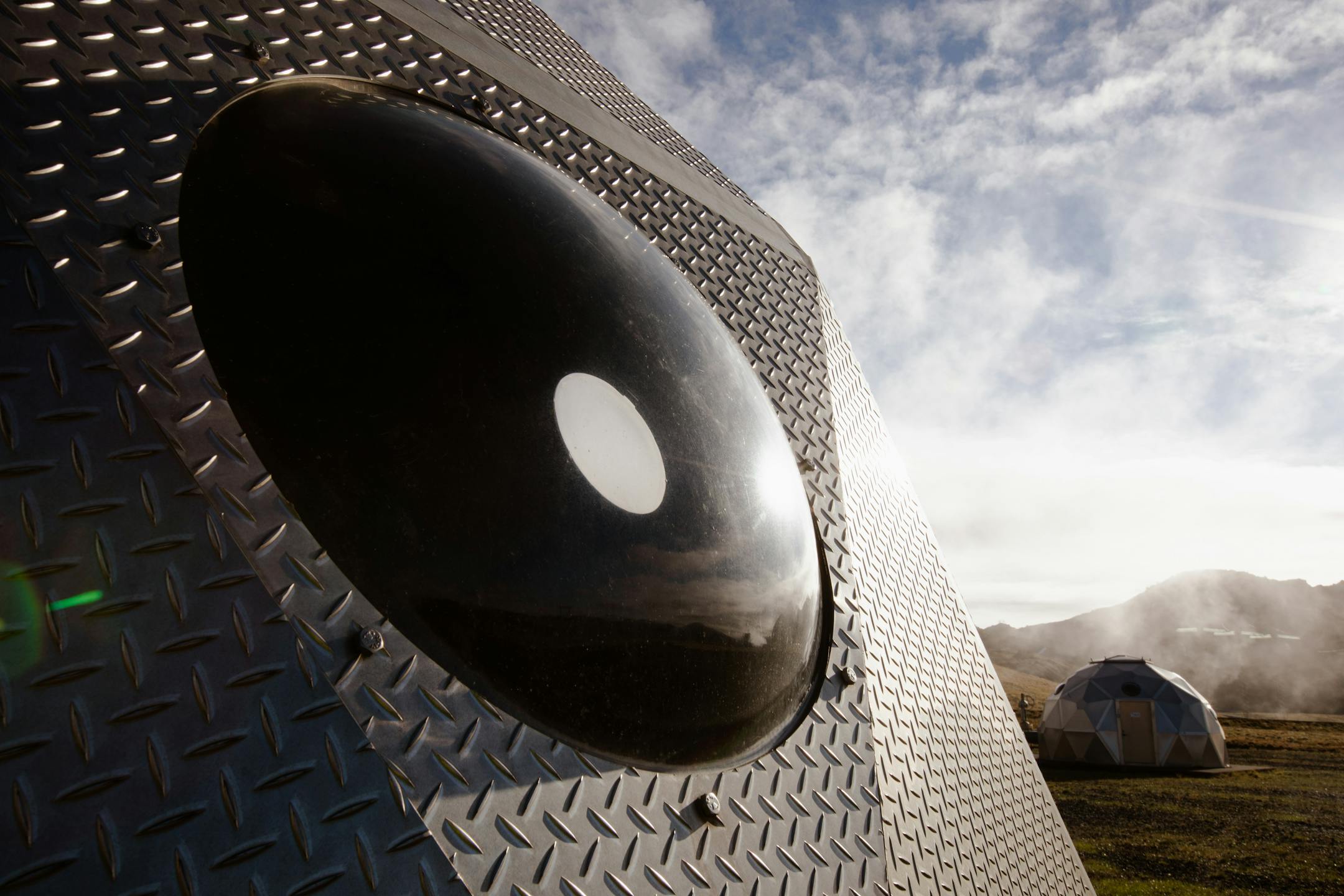Steel igloos cover injection wells that the Icelandic start-up company Carbfix uses to inject carbon dioxide into the earth outside Reykjavik, Iceland, on Oct. 6, 2021. Carbfix has discovered that its CO2 mix will chemically react with basalt and turn to rock in just two or three years instead of the centuries that the mineralization process was believed to take. (Sigga Ella/The New York Times)