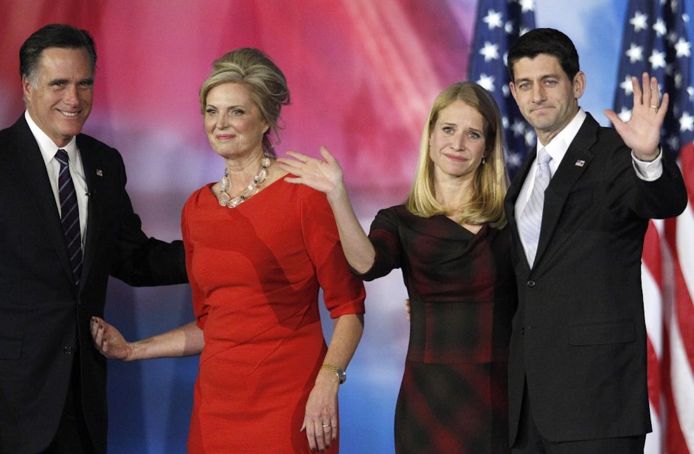 Republican presidential candidate and former Massachusetts Gov. Mitt Romney and his wife Ann Romney, left, and vice presidential candidate Paul Ryan and his wife Janna, right, wave to supporters after Romney conceded the election.