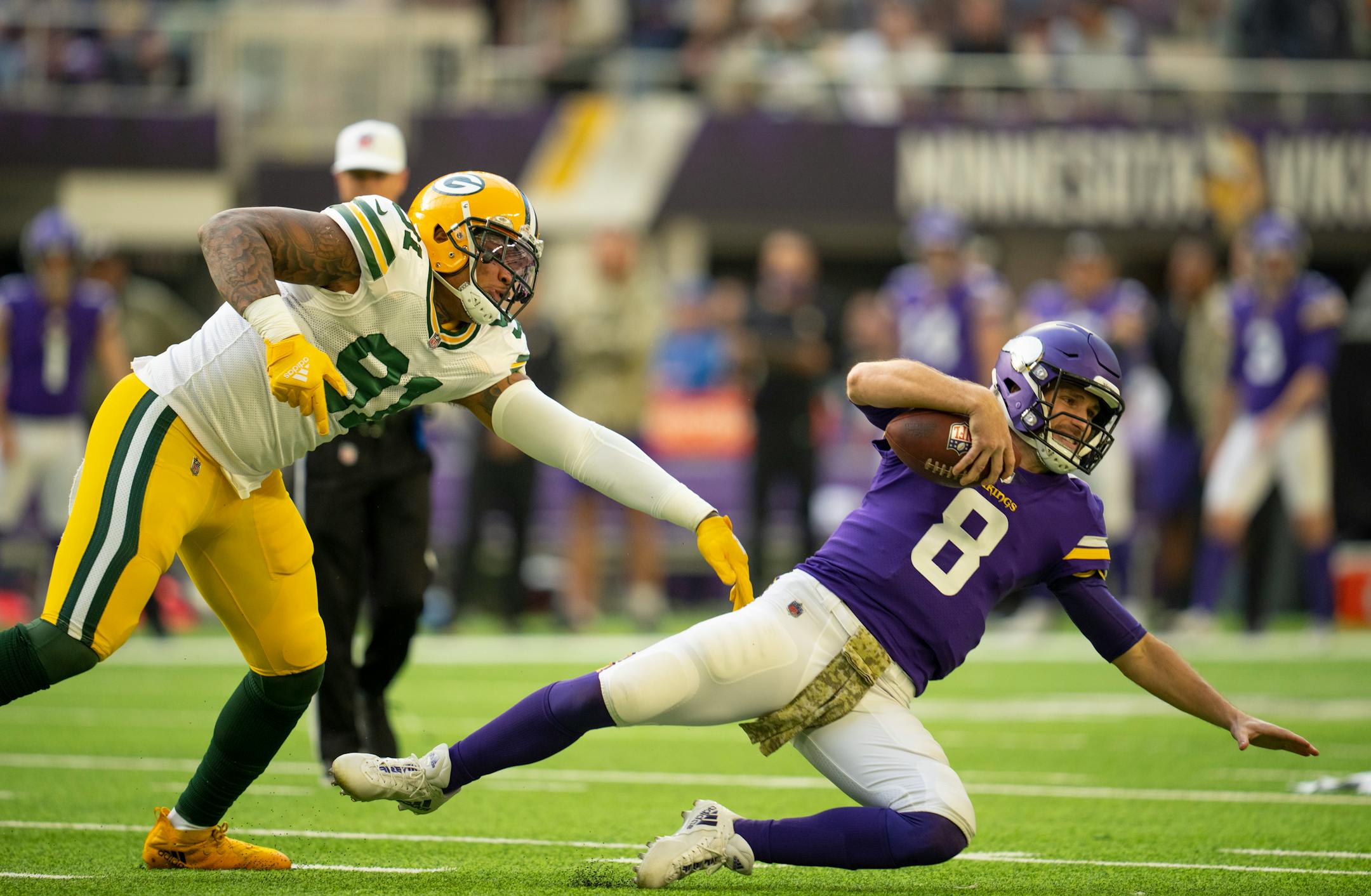 Green Bay Packers outside linebacker Preston Smith (91) sacked Minnesota Vikings quarterback Kirk Cousins (8) for a loss in the first quarter.