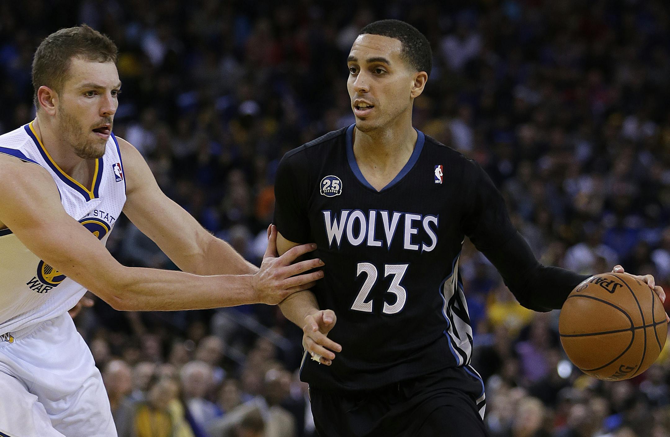 Golden State Warriors' David Lee, left, guards Minnesota Timberwolves' Kevin Martin (23) during the second half of an NBA basketball game Friday, Jan. 24, 2014, in Oakland, Calif. (AP Photo/Ben Margot)