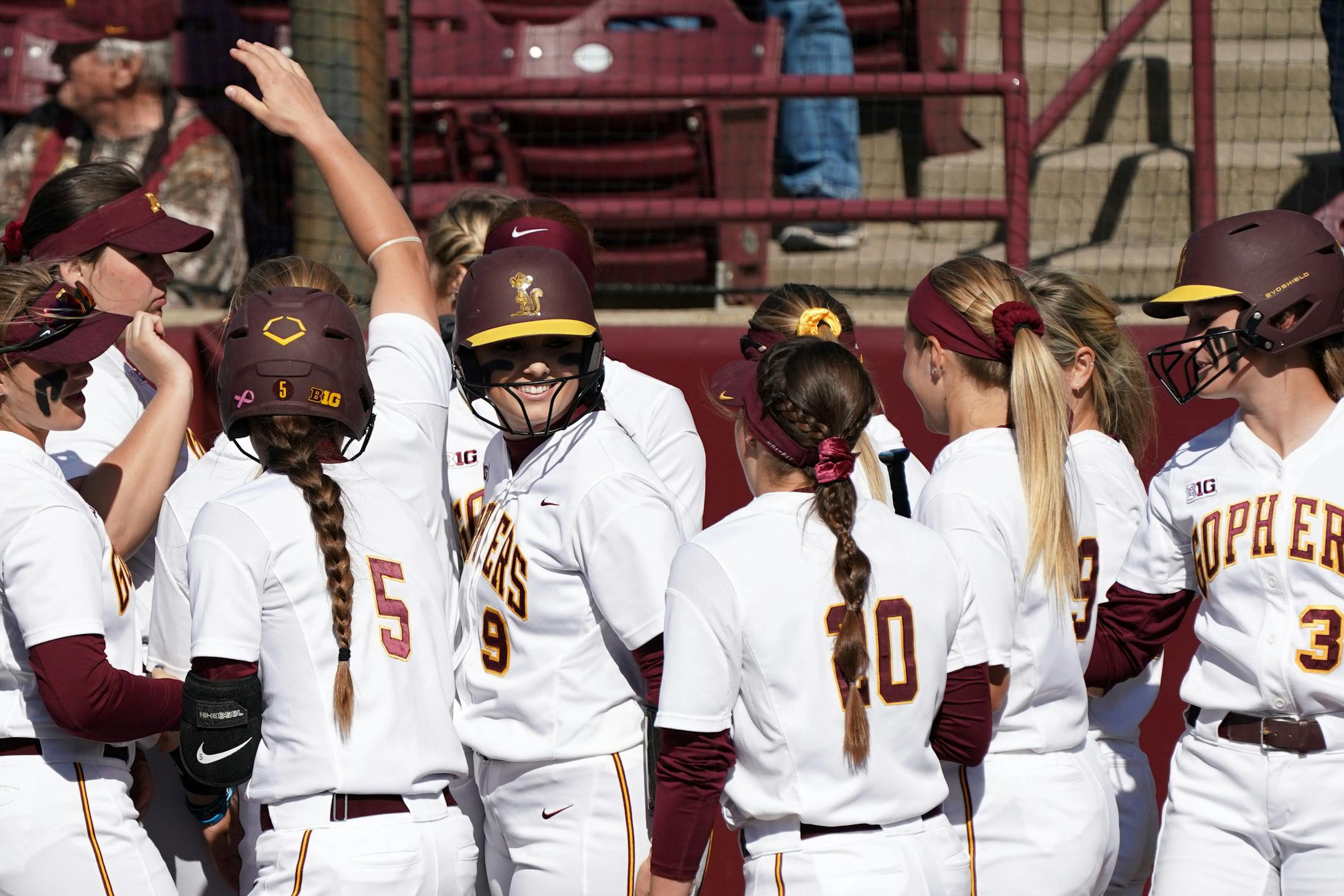 Gophers' first baseman Hope Brandner was congratulated by teammates after hitting a home run in April.