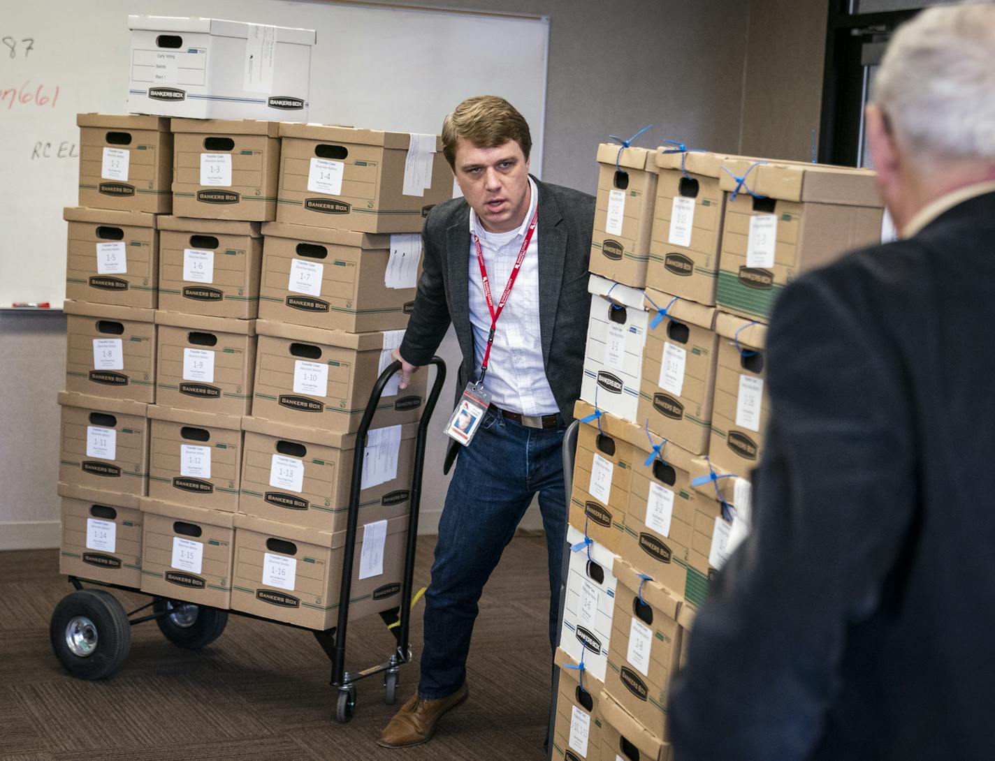 David Triplett, interim elections manager for Ramsey County, organized boxes of polling place ballots before the counting began. ] LEILA NAVIDI &#x2022; leila.navidi@startribune.com BACKGROUND INFORMATION: Ramsey County elections staff conducted the count of ranked-choice votes in the two undecided races for St. Paul City Council at the Ramsey County Elections office in St. Paul on Friday, November 8, 2019.