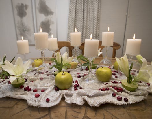 Upcycled Edible: Arrange mismatched glassware from Goodwill around limes, apples and cranberries, created by Jeralyn Mohr, Full Nest.
