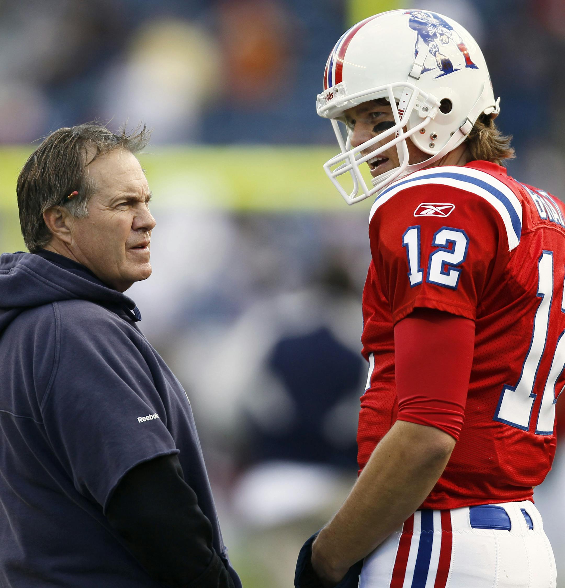 New England Patriots coach Bill Belichick talks with quarterback Tom Brady prior to an NFL football game against the Minnesota Vikings in Foxborough, Mass., Sunday, Oct. 31, 2010. (AP Photo/Winslow Townson) ORG XMIT: FBO103