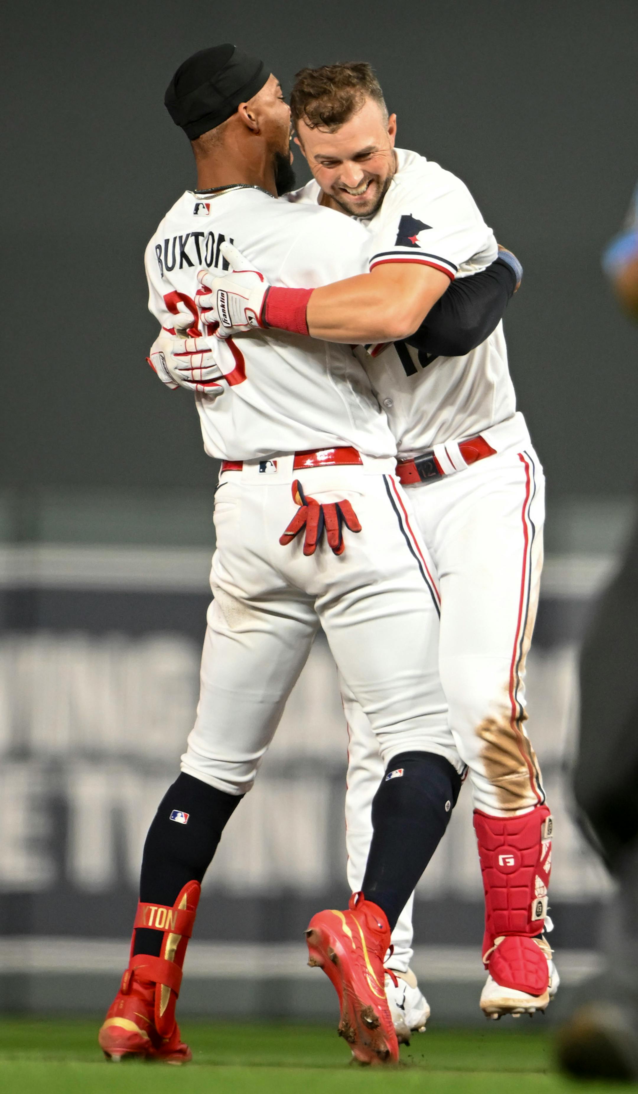 Minnesota Twins designated hitter Byron Buxton (25) celebrates with Minnesota Twins third baseman Kyle Farmer (12) after Farmer's walk-off single in the bottom of the 10th inning against the Boston Red Sox Wednesday, June 21, 2023, at Target Field in Minneapolis, Minn.