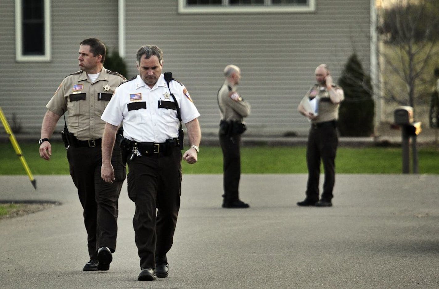 Chisago County Sheriff Rick Duncan, front, walks towards the waiting media for a press conference and to give the grim news of a body recovered and presumed to be Danielle Jelinek's in Chisago City, MN. Sheriff Duncan, however, would not confirm at this point that it was Jelinek.