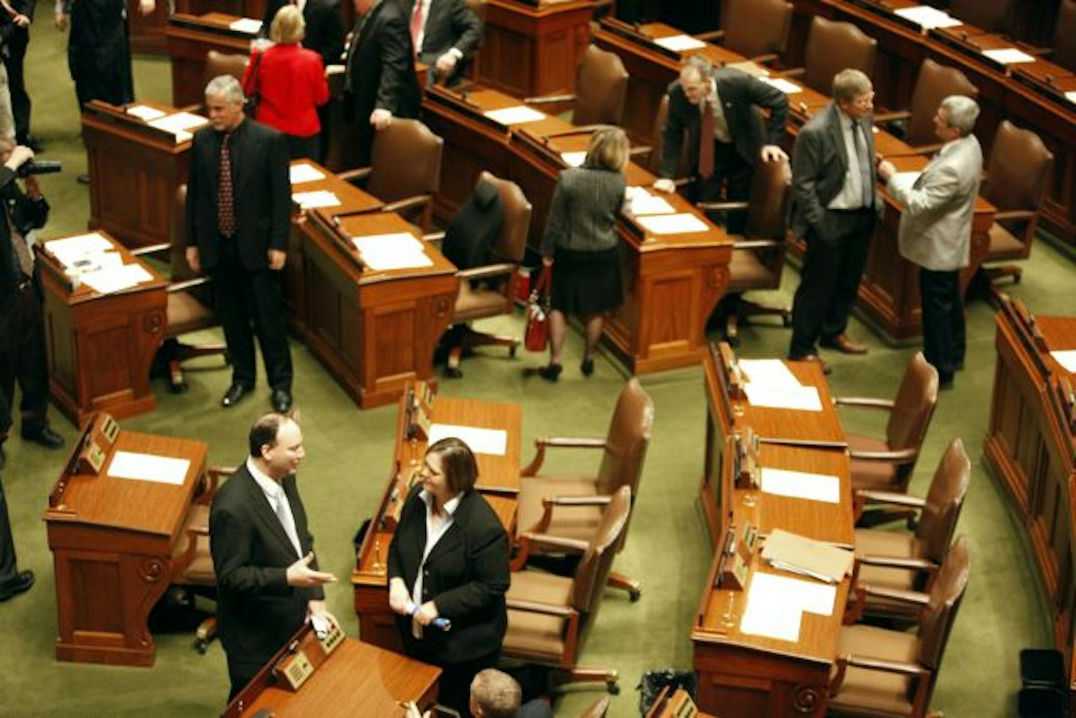 Rep. Marty Seifert, left, and Margaret Anderson Kelliher greeted each other Thursday on the first day of the 2010 Legislature.